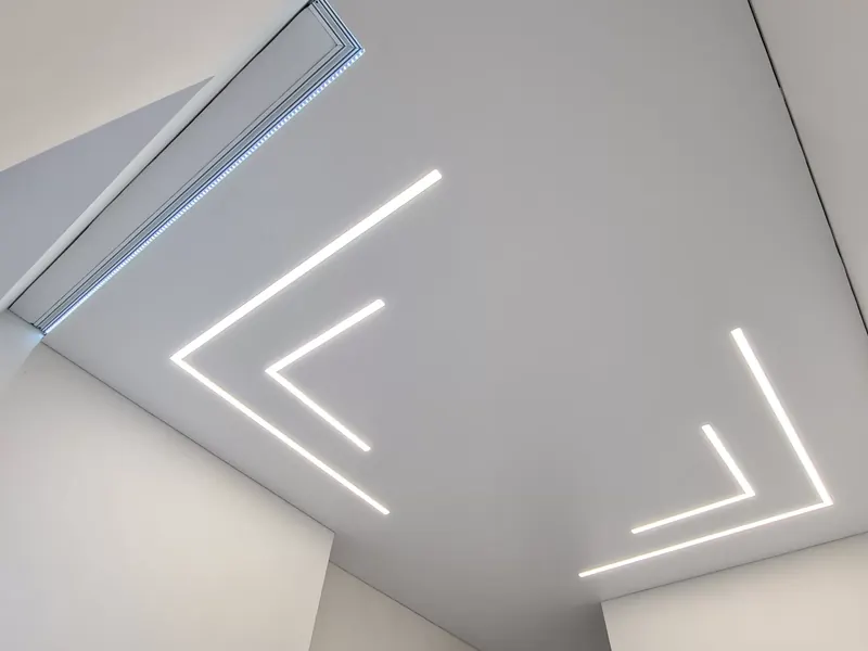 Satin stretch ceiling with two recessed light lines